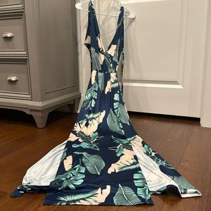 Full length floral sundress with multiple cut outs. Slits up both sides.